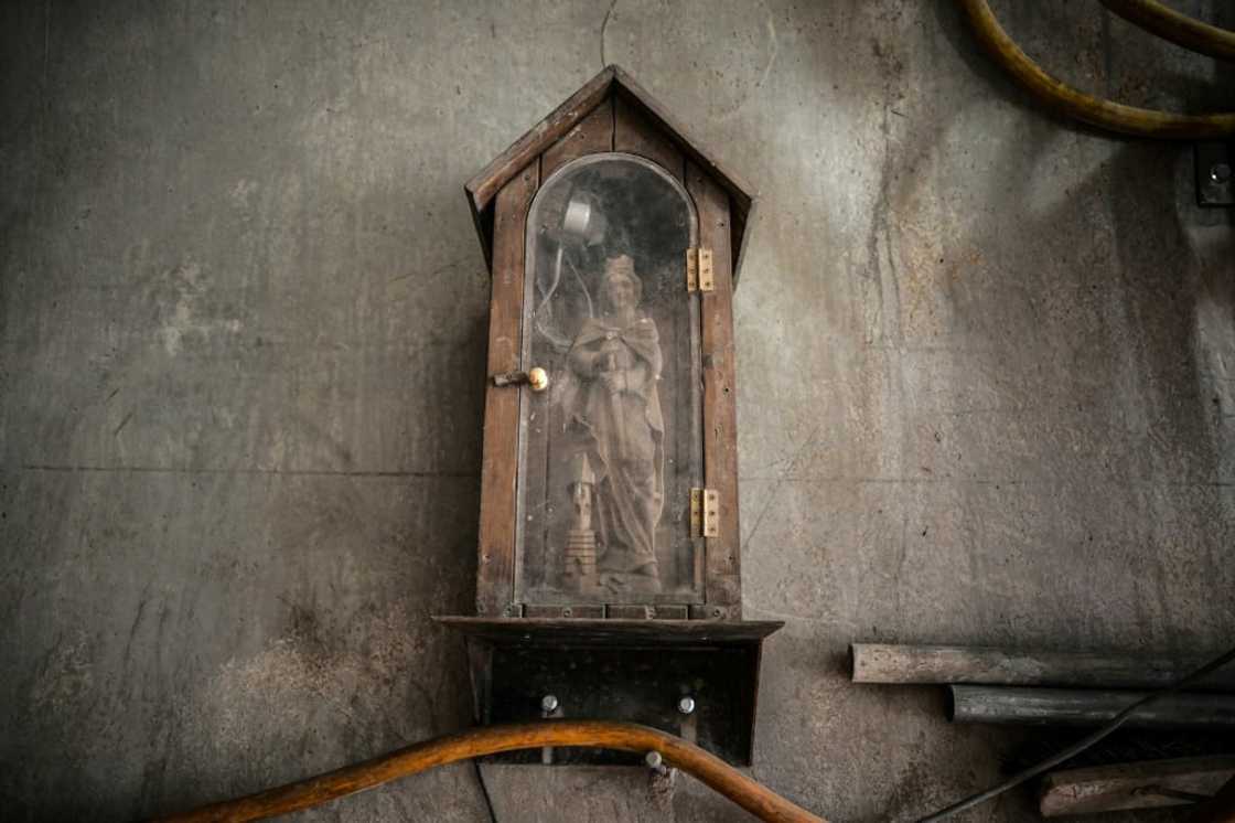 A statue of Saint Barbara, the patron of tunnelling, watches over the construction A statue of Saint Barbara, the patron of tunnelling, watches over the construction