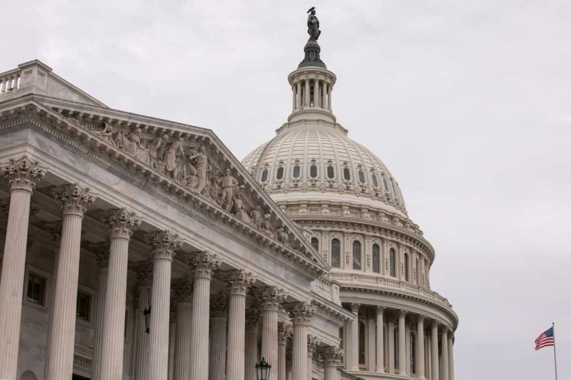 The United States' credit rating will remain on negative watch despite a debt limit deal to avert a default, said Fitch Ratings The United States' credit rating will remain on negative watch despite a debt limit deal to avert a default, said Fitch Ratings
