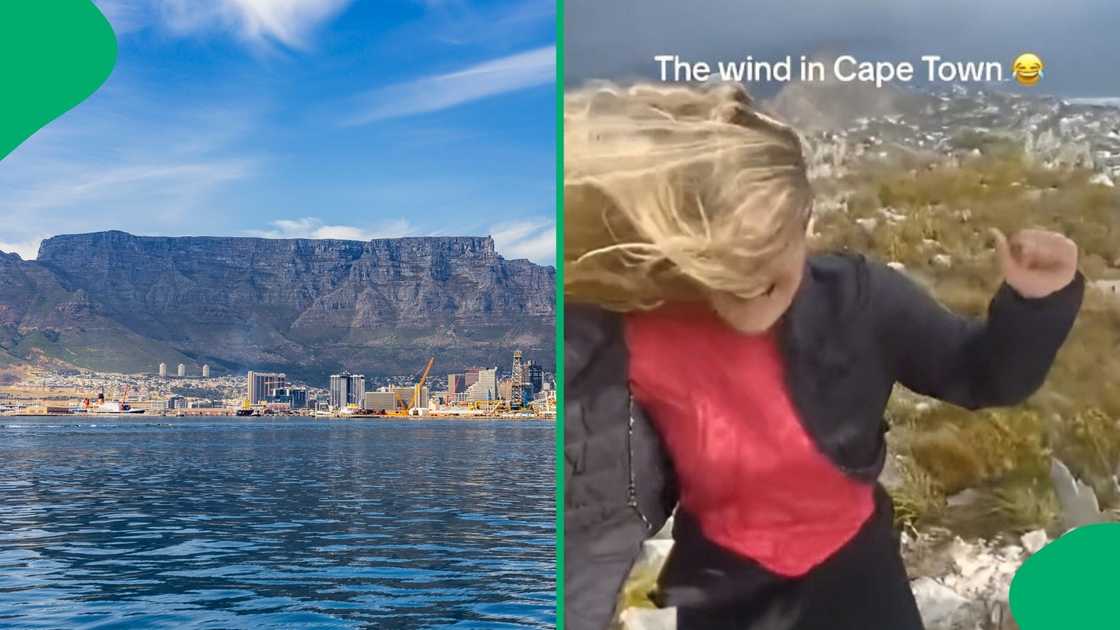 Women standing on Table Mountain showed how windy it was in Cape Town.