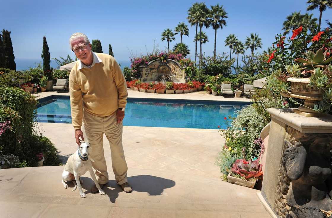 William Lerach stands for a photograph near the swimming pool