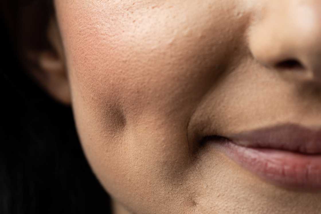 A woman smiling and having dimples A woman smiling and having dimples
