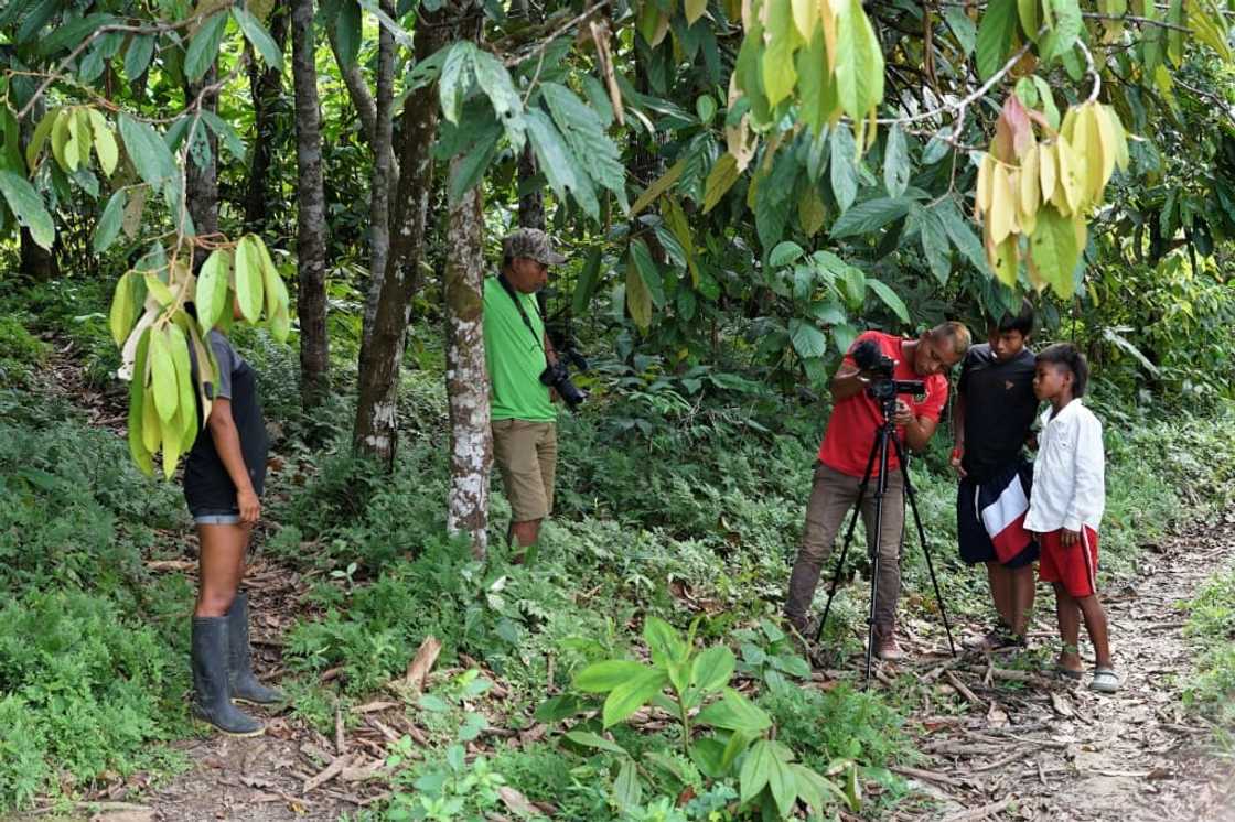 Tikuna indigenous filmmakers film documentary short films with the support of Matis indigenous filmmakers in San Martin de Amacayacu, Colombia, on October 14, 2022