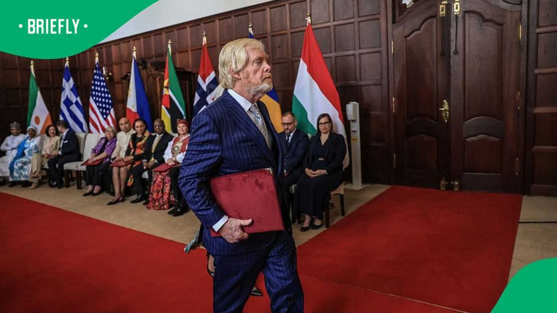 US Ambassador to South Africa Leo Brent Bozell III walks to present letters of credence to South African President Cyril Ramaphosa at Sefako Makgatho Presidential Guest House in Pretoria on April 8, 2026