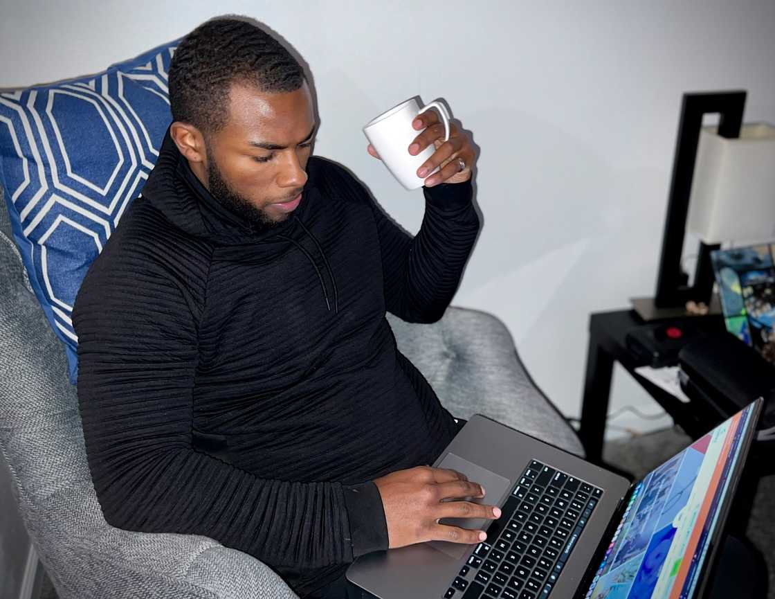 A man typing something on a laptop A man typing something on a laptop