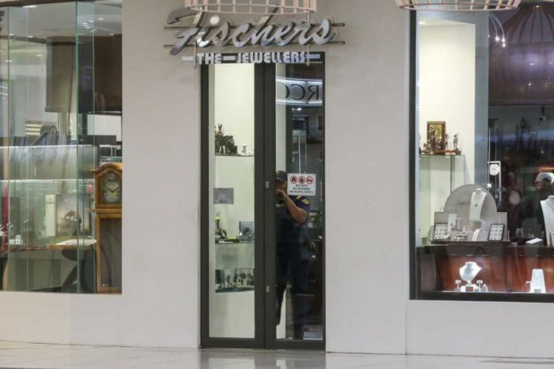 A police officer is spotted inside Fischer's at the Greenacres Shopping Centre. The jeweler store was robbed by a group or armed men. A police officer is spotted inside Fischer's at the Greenacres Shopping Centre. The jeweler store was robbed by a group or armed men.