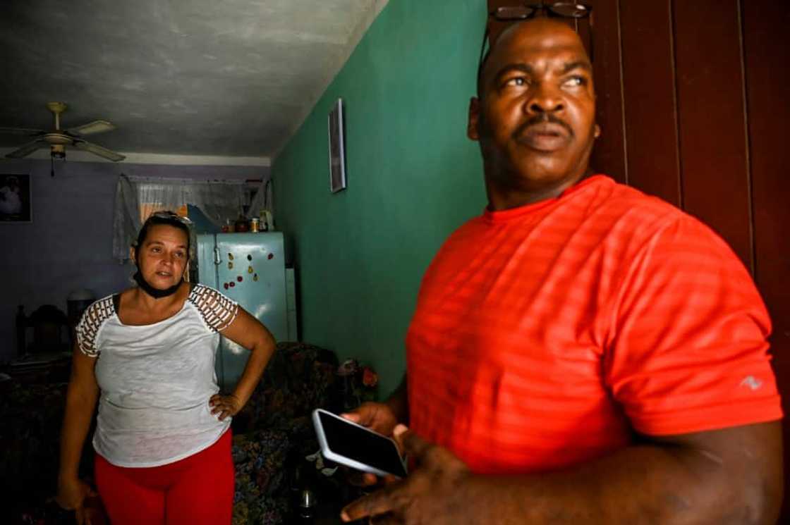 Elizabet Leon Martinez, who has had three children imprisoned for anti-government protests, and Luis Wilber Aguilar, whose son Wagniel Aguilar is also serving time for the same reason, are seen in the neighborhood of La Guinera on the outskirts of Havana in June 2022 Elizabet Leon Martinez, who has had three children imprisoned for anti-government protests, and Luis Wilber Aguilar, whose son Wagniel Aguilar is also serving time for the same reason, are seen in the neighborhood of La Guinera on the outskirts of Havana in June 2022