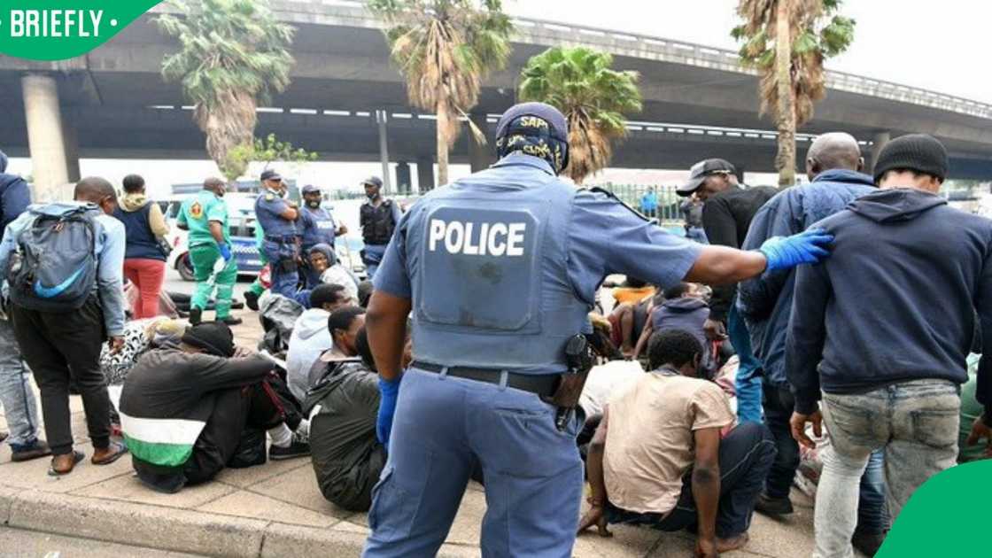 Police remove protesting immigrants