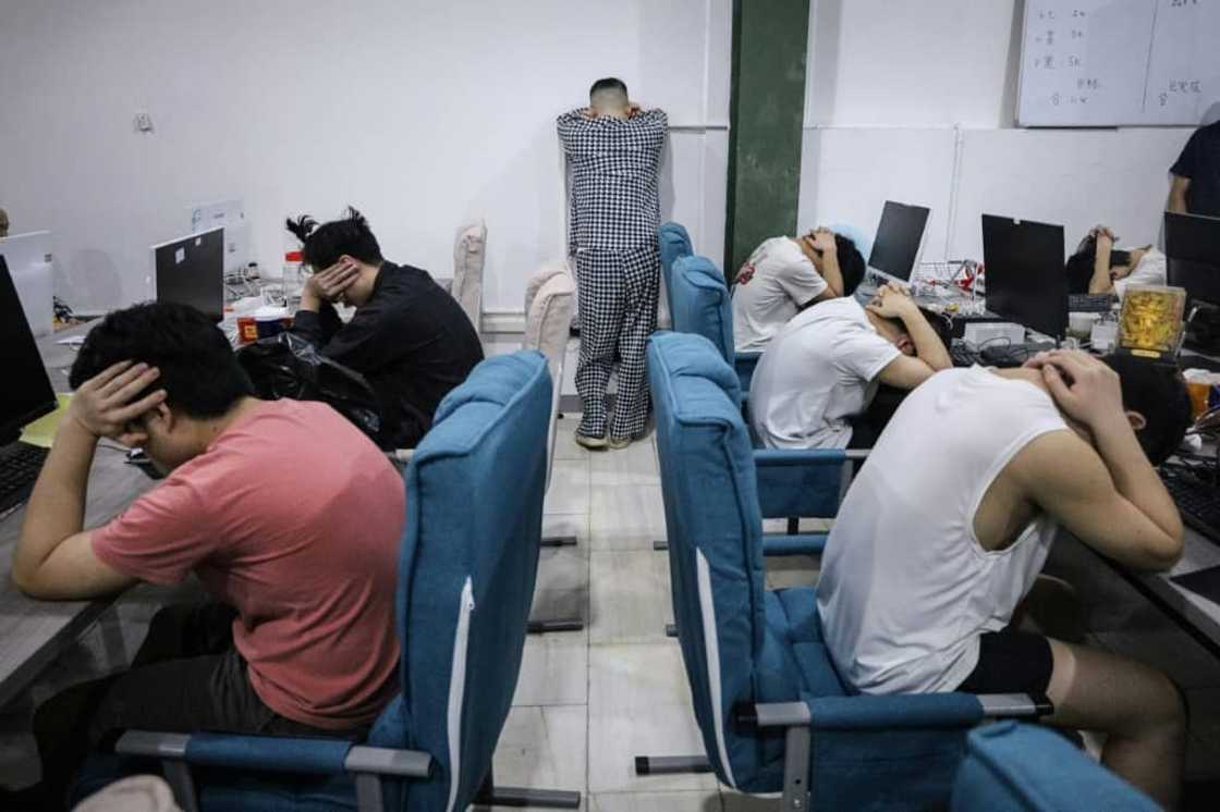Police said the syndicate blackmailed hundreds of victims in China, many of whom were public officials. Police said the syndicate blackmailed hundreds of victims in China, many of whom were public officials.