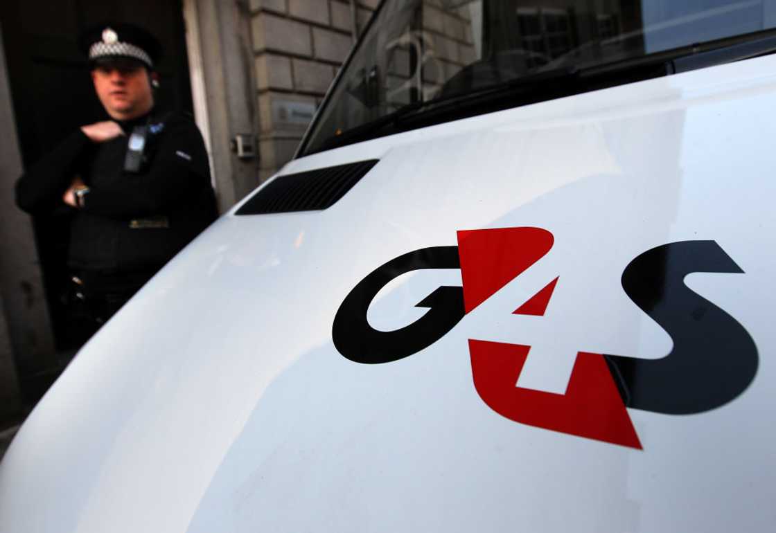 Man dances by G4S van