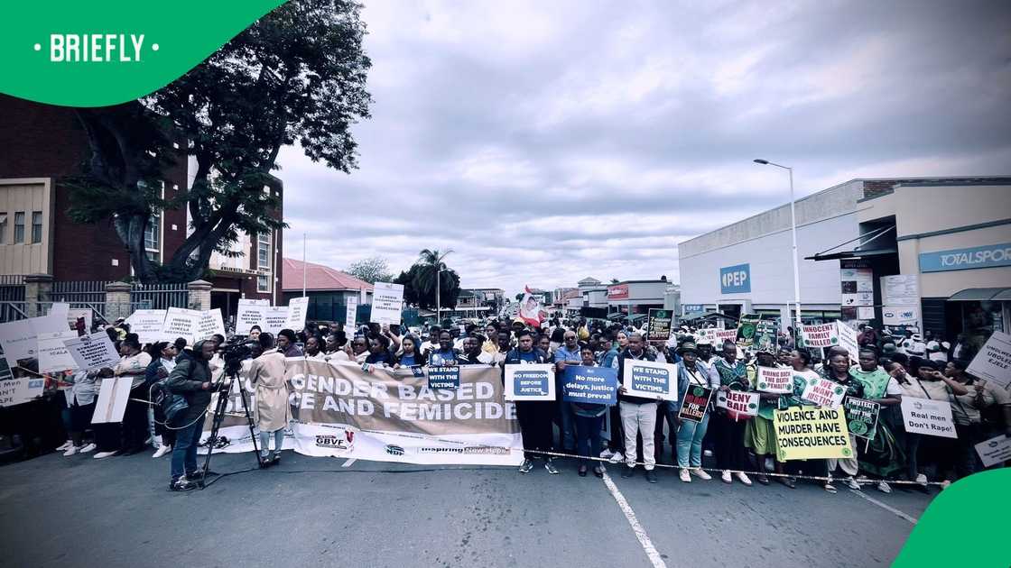 Members of the community protested outside the KwaDukuza Magistrates Court prior to the appearance of the men accused of killing the Monswamy family Members of the community protested outside the KwaDukuza Magistrates Court prior to the appearance of the men accused of killing the Monswamy family