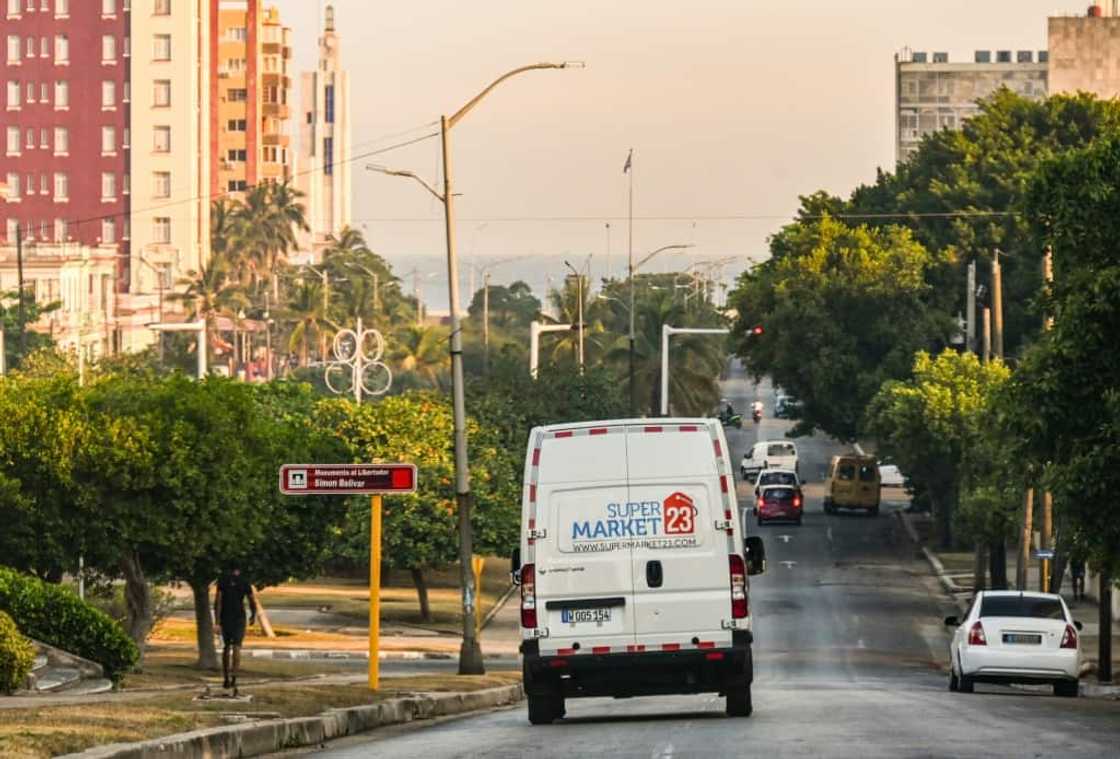 A delivery van from a US-based food remittance company drives on a street in Havana on May 22, 2024 A delivery van from a US-based food remittance company drives on a street in Havana on May 22, 2024