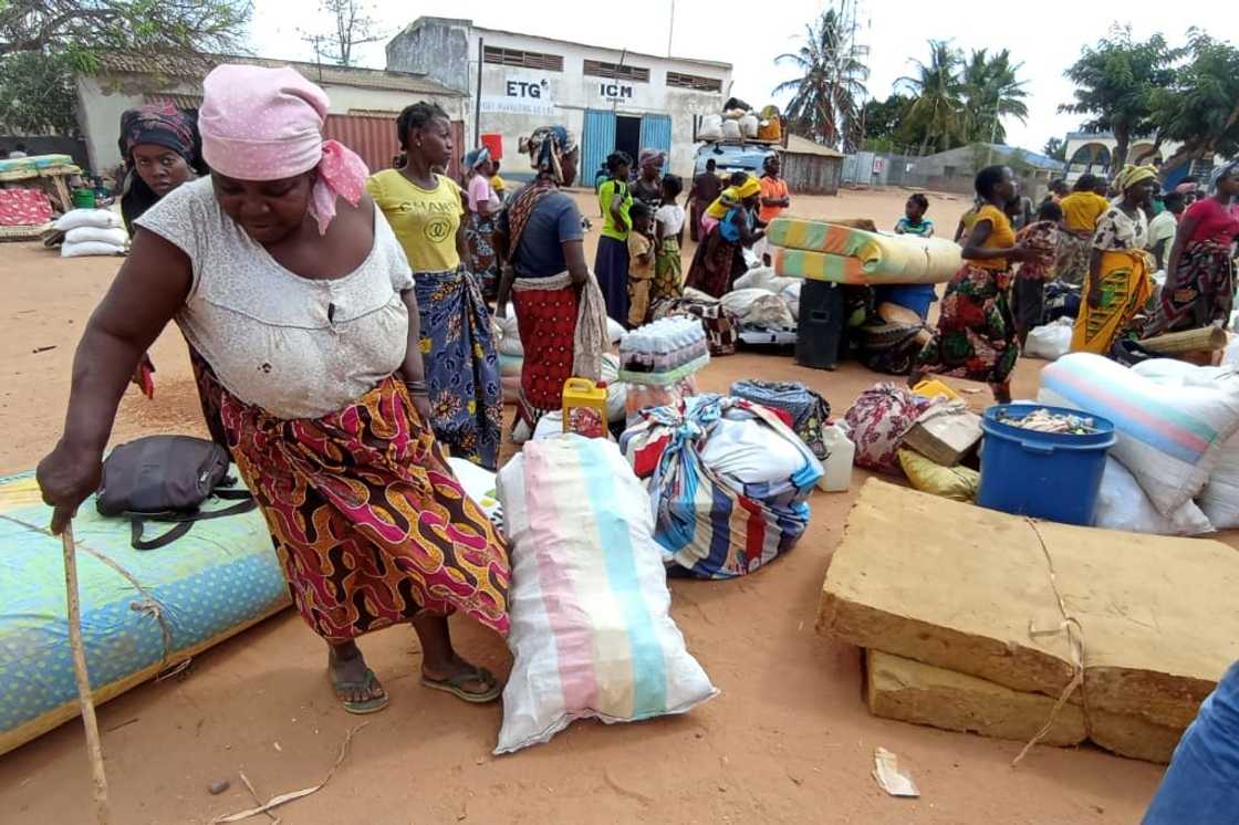 Many people had trekked for dozens of kilometres, taking with them whatever possessions they could carry Many people had trekked for dozens of kilometres, taking with them whatever possessions they could carry