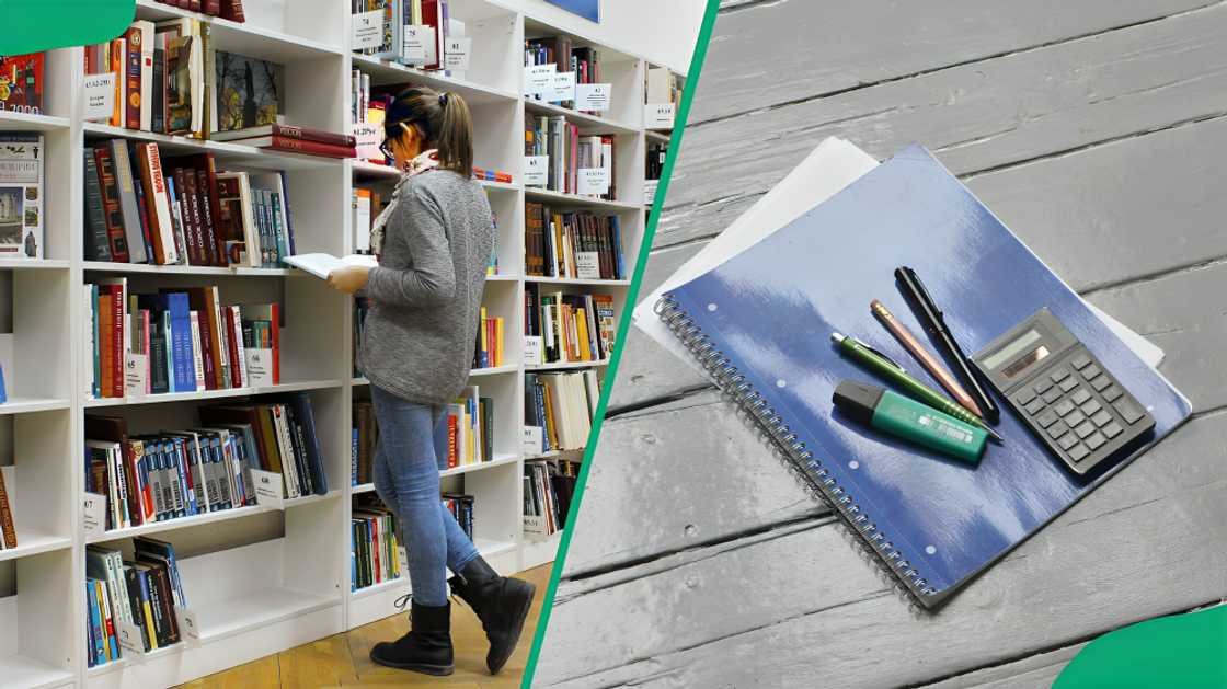 A female student in the library, a book, calculator and pens A female student in the library, a book, calculator and pens