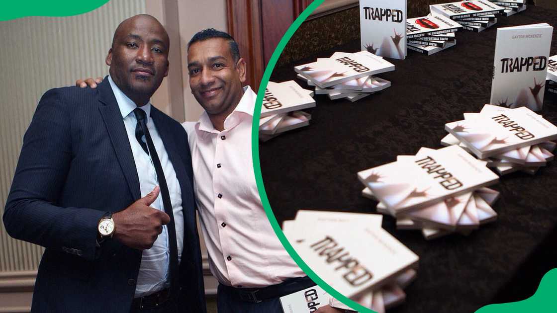 Gayton McKenzie with a friend during a book signing event and a table with his book Trapped Gayton McKenzie with a friend during a book signing event and a table with his book Trapped