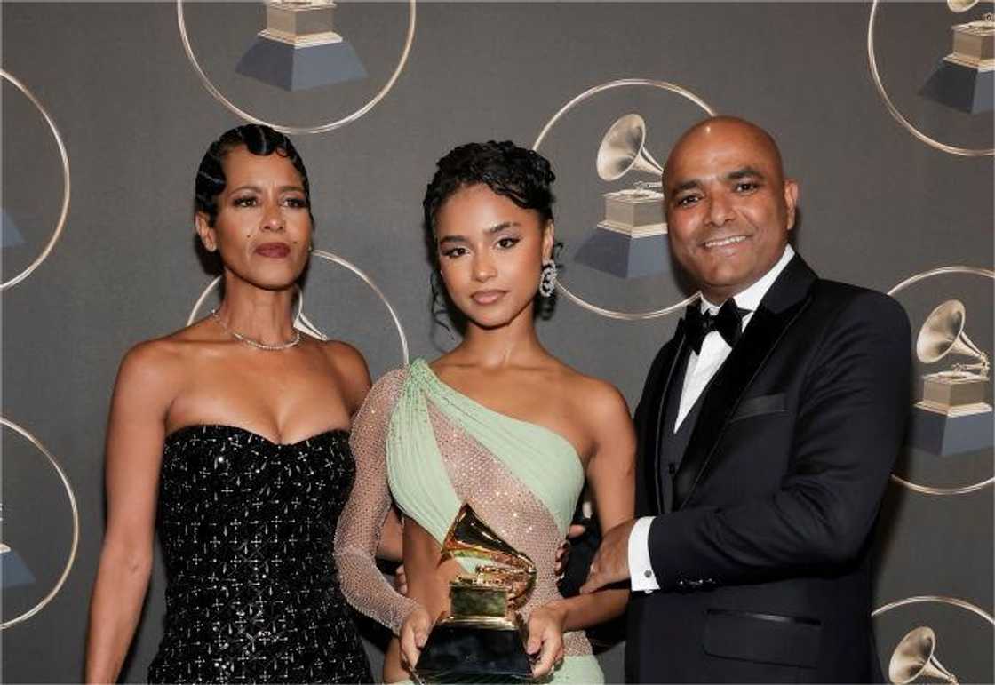 Tyla and her parents at the 66th GRAMMY Awards Tyla and her parents at the 66th GRAMMY Awards