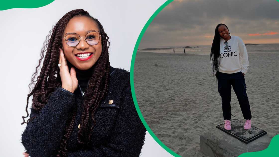 Jackie Phamotse smiles in a black top and she stands besides a body of water