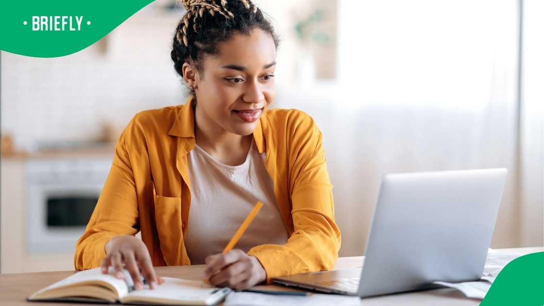 A stock image of woman doing school work