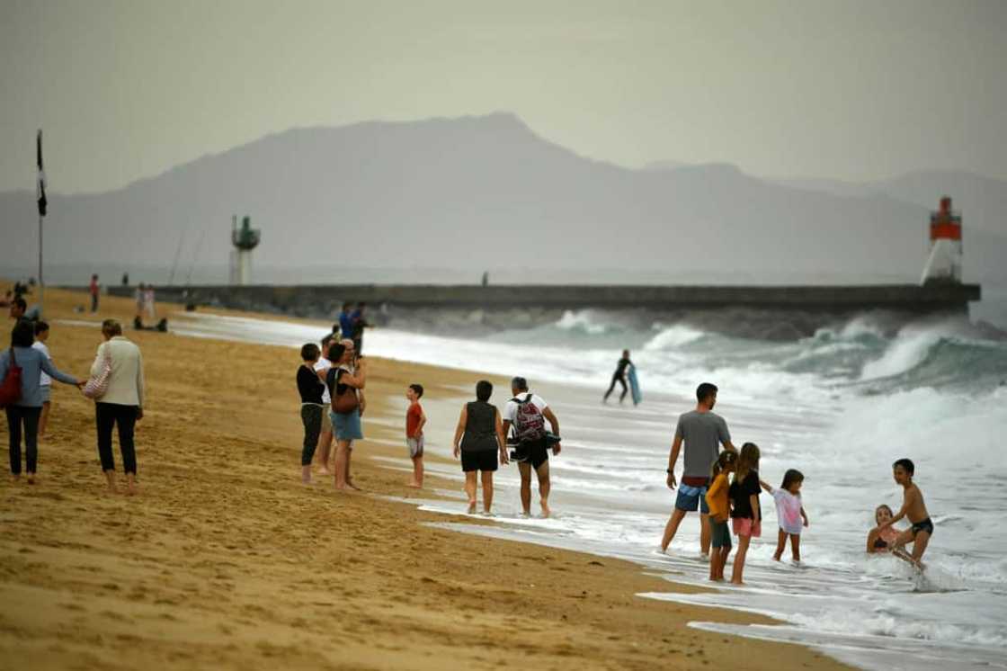 Warm October weather has seen many flock to the beach -- such as here at Hossegor, southwestern France -- but environmentalists see more evidence of climate change Warm October weather has seen many flock to the beach -- such as here at Hossegor, southwestern France -- but environmentalists see more evidence of climate change