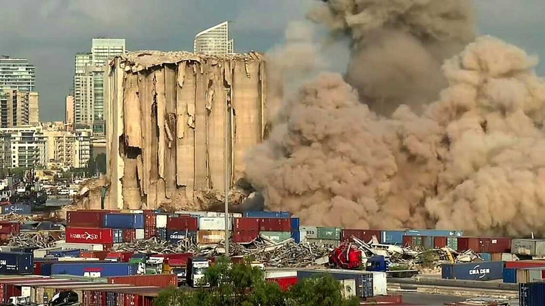 This grab from AFPTV footage shows a massive plume of smoke rising over Beirut port after the collapse of eight more grain silos damaged in a devastating 2020 explosion This grab from AFPTV footage shows a massive plume of smoke rising over Beirut port after the collapse of eight more grain silos damaged in a devastating 2020 explosion