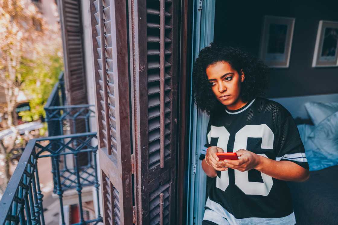 A sad lady is texting on her phone A sad lady is texting on her phone