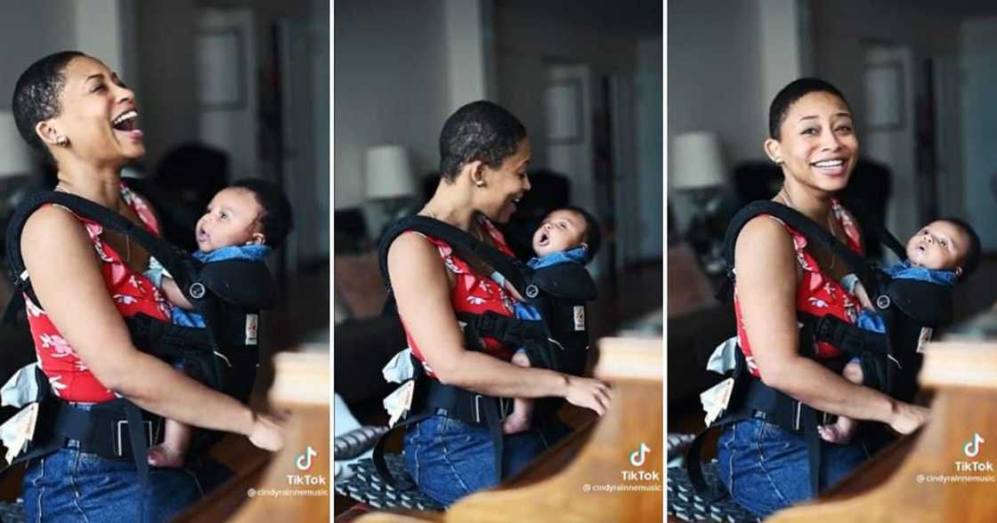 An adorable baby threw up on the mommy while she played piano. An adorable baby threw up on the mommy while she played piano.
