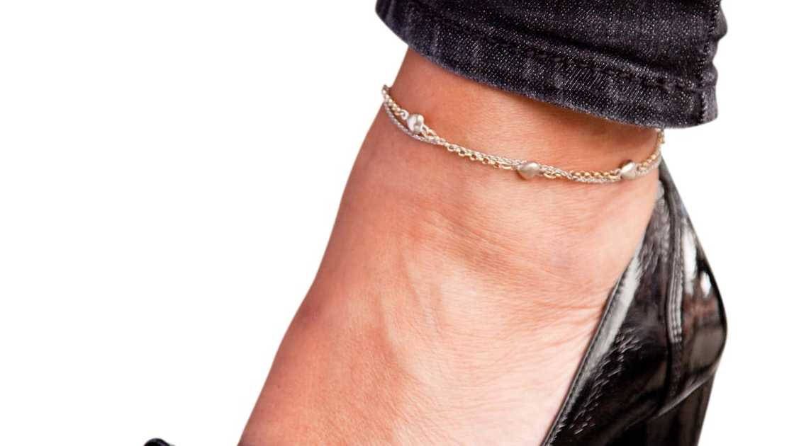 A woman wearing an anklet A woman wearing an anklet
