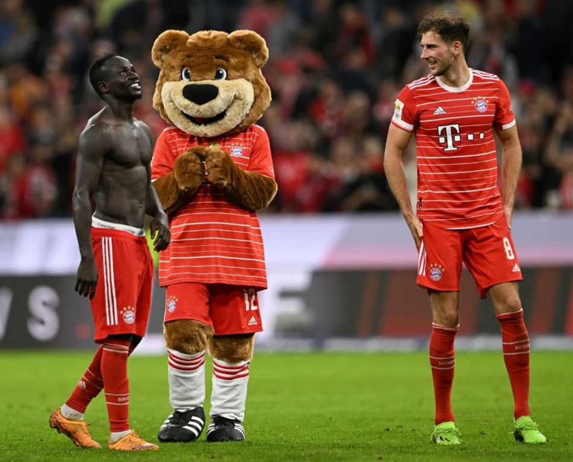 Bayern Munich scorer Sadio Mane (L) with the team mascot after defeating Freiburg. Bayern Munich scorer Sadio Mane (L) with the team mascot after defeating Freiburg.
