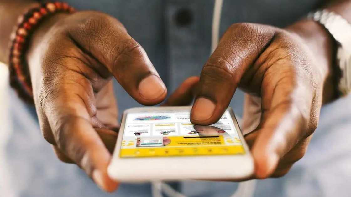 A person using a phone A person using a phone