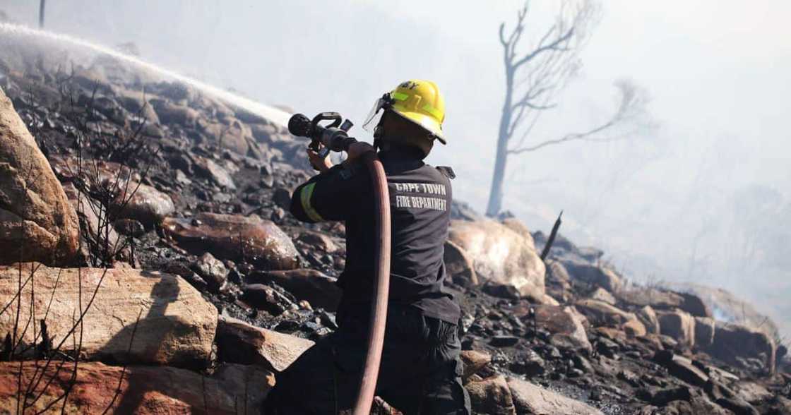 Firefighter beats flames