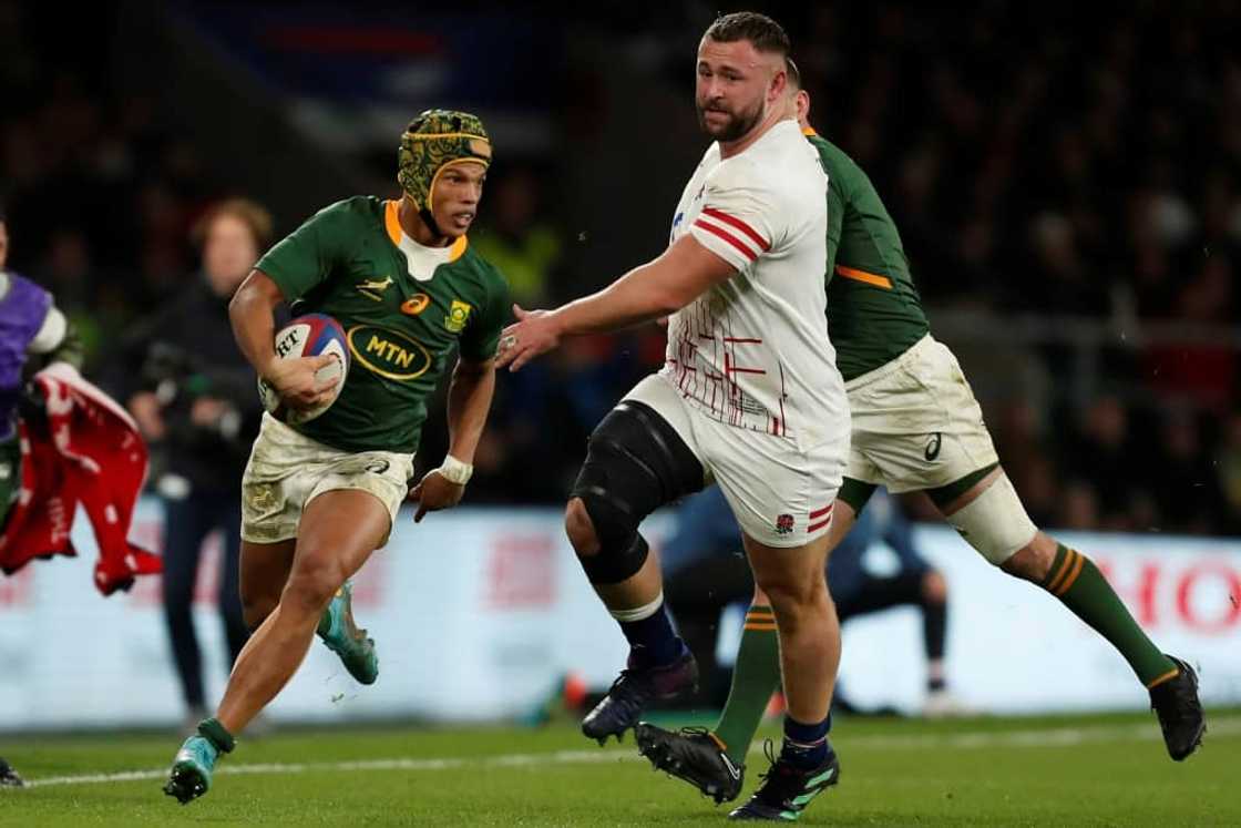 Try-scorer - South Africa wing Kurt-Lee Arendse (L) on the attack against England at Twickenham Try-scorer - South Africa wing Kurt-Lee Arendse (L) on the attack against England at Twickenham