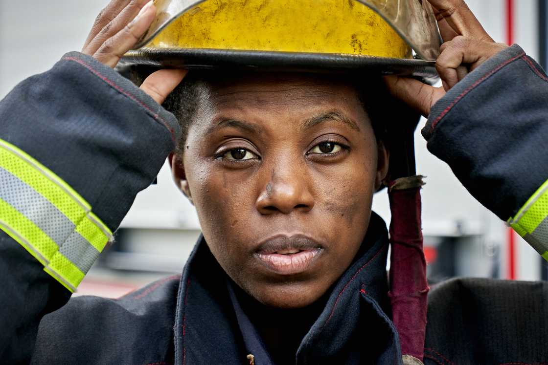 A woman demonstrates fire-safety techniques. A woman demonstrates fire-safety techniques.