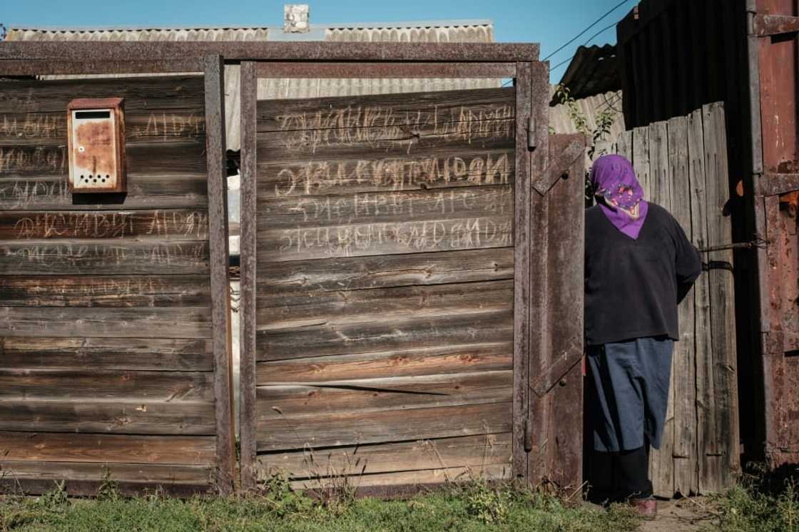 Vera Schetynkyna enters her house in the recently retaken town of Yampil, near Lyman, in the Donetsk region Vera Schetynkyna enters her house in the recently retaken town of Yampil, near Lyman, in the Donetsk region
