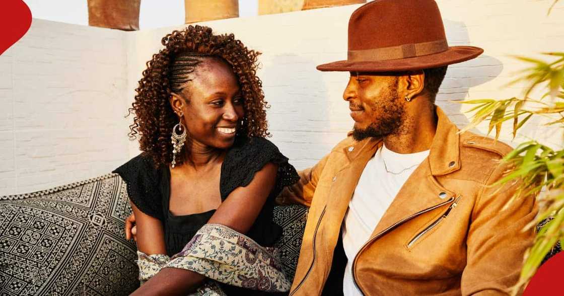 A lady smiling during a date with a man. A lady smiling during a date with a man.