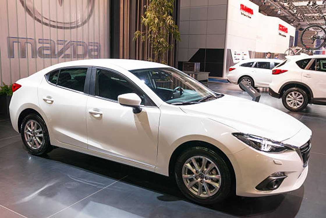 White Mazda 3 sedan car in Brussels, Belgium