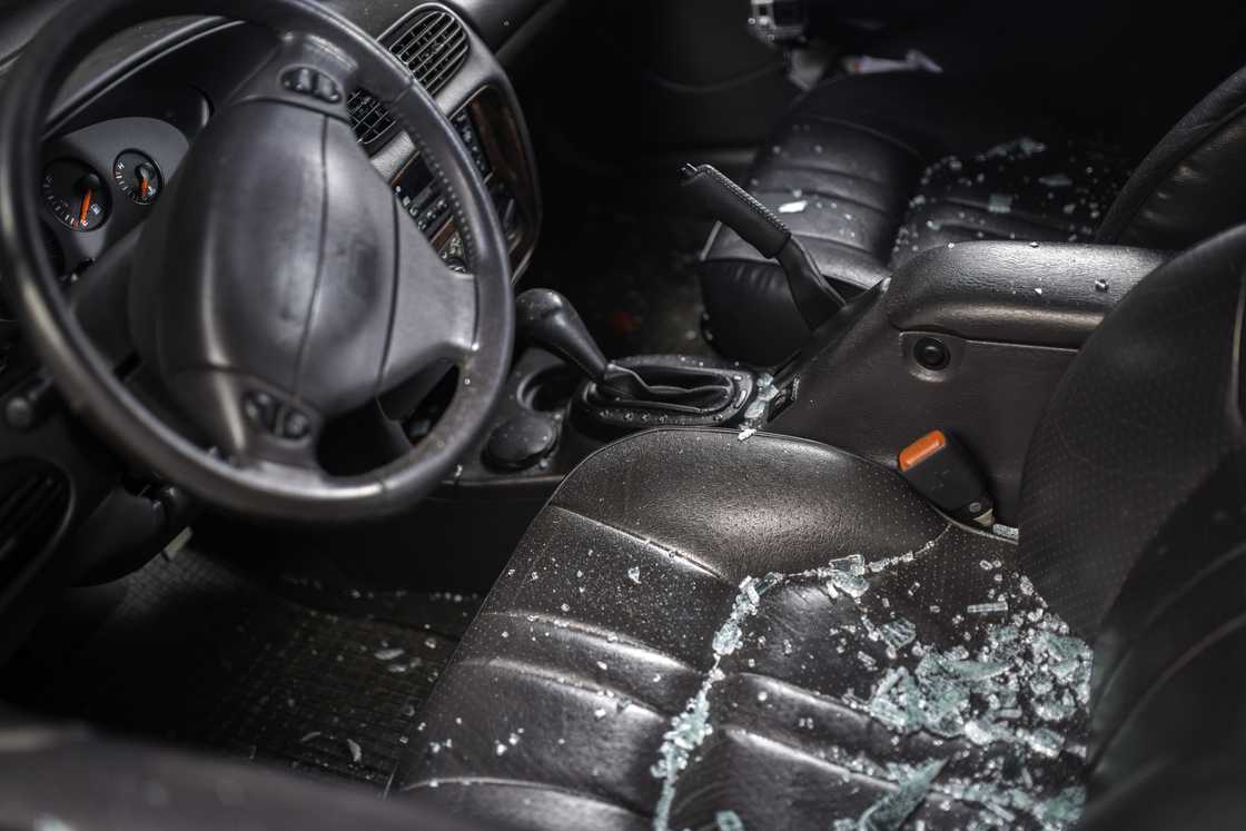 A car window smashed by a thief A car window smashed by a thief