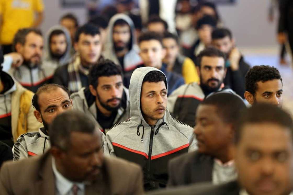 The migrants were dressed in differing tracksuits to identify their nationalities