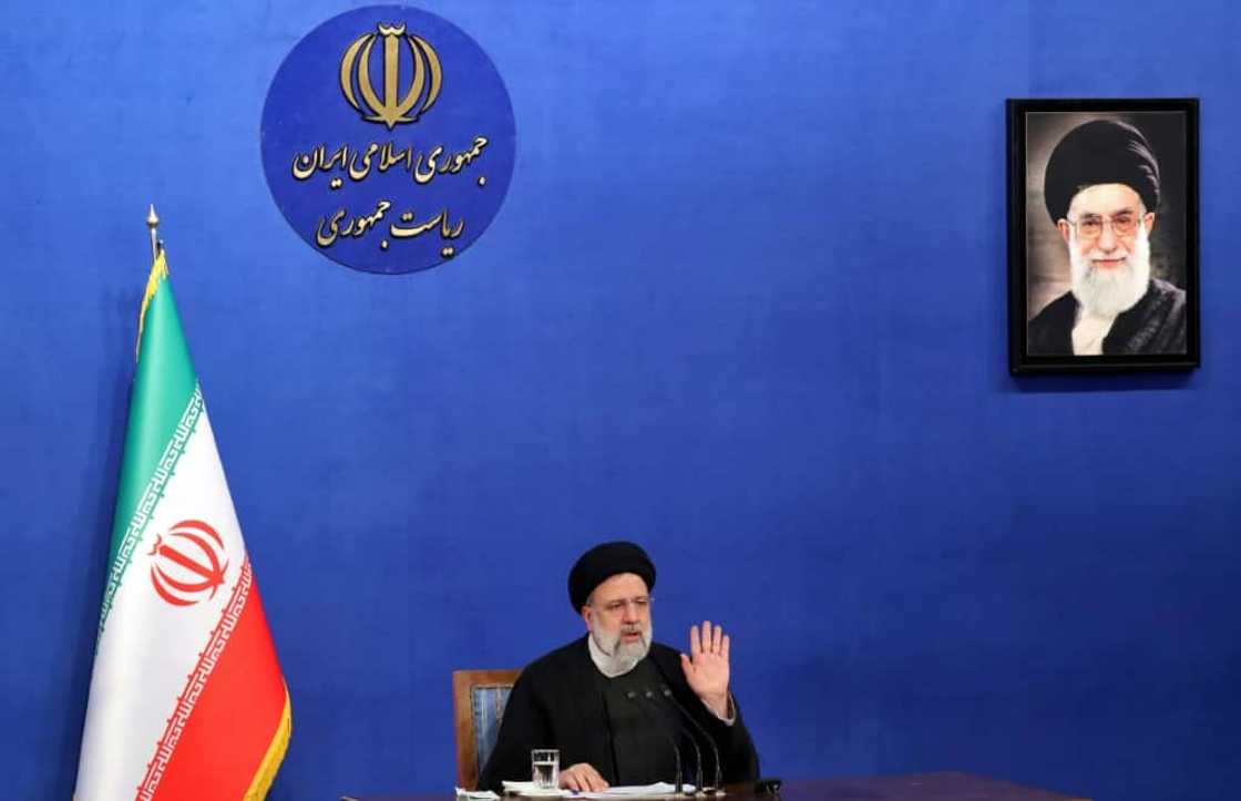 Iranian President Ebrahim Raisi sits near a portrait of Iran's Supreme Leader Ayatollah Ali Khamenei as he speaks during a press conference in Tehran on August 29, 2022 Iranian President Ebrahim Raisi sits near a portrait of Iran's Supreme Leader Ayatollah Ali Khamenei as he speaks during a press conference in Tehran on August 29, 2022