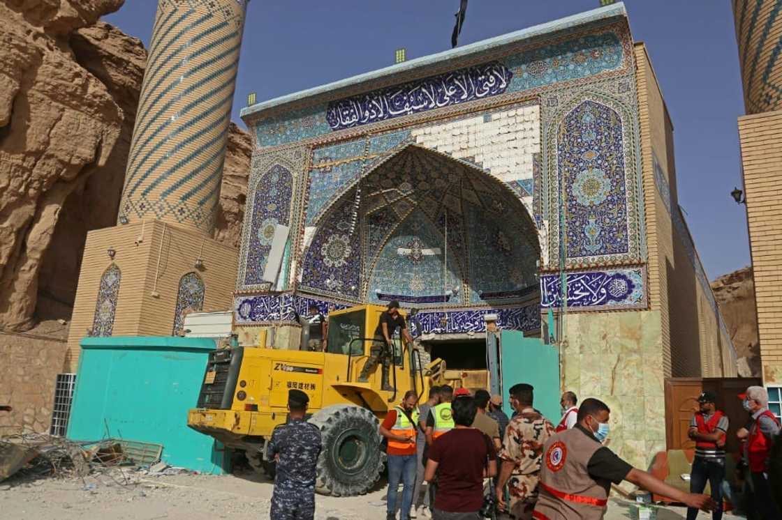 Between six and eight pilgrims had been reported trapped under the debris of the shrine, known as Qattarat al-Imam Ali, civil defence spokesman Nawas Sabah Shaker had said earlier Between six and eight pilgrims had been reported trapped under the debris of the shrine, known as Qattarat al-Imam Ali, civil defence spokesman Nawas Sabah Shaker had said earlier
