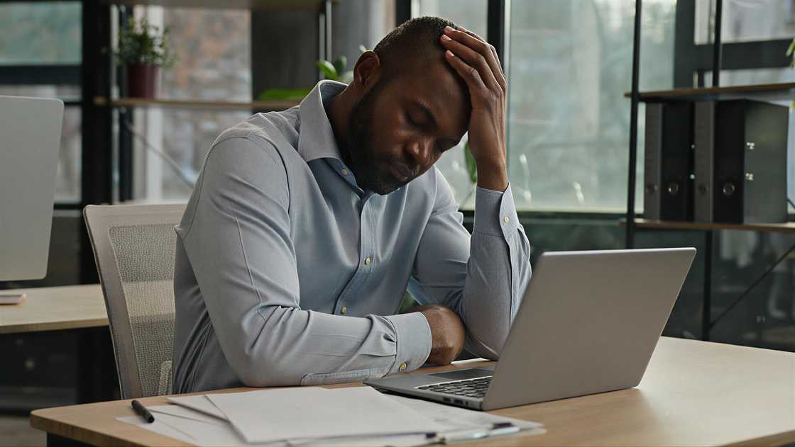 Overworked African American mature ma