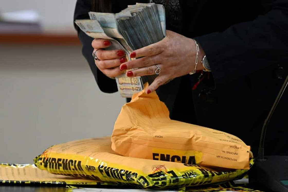 Prosecutors present as evidence the cash they allege Guatemalan journalist Jose Ruben Zamora tried to give to a banker to deposit Prosecutors present as evidence the cash they allege Guatemalan journalist Jose Ruben Zamora tried to give to a banker to deposit
