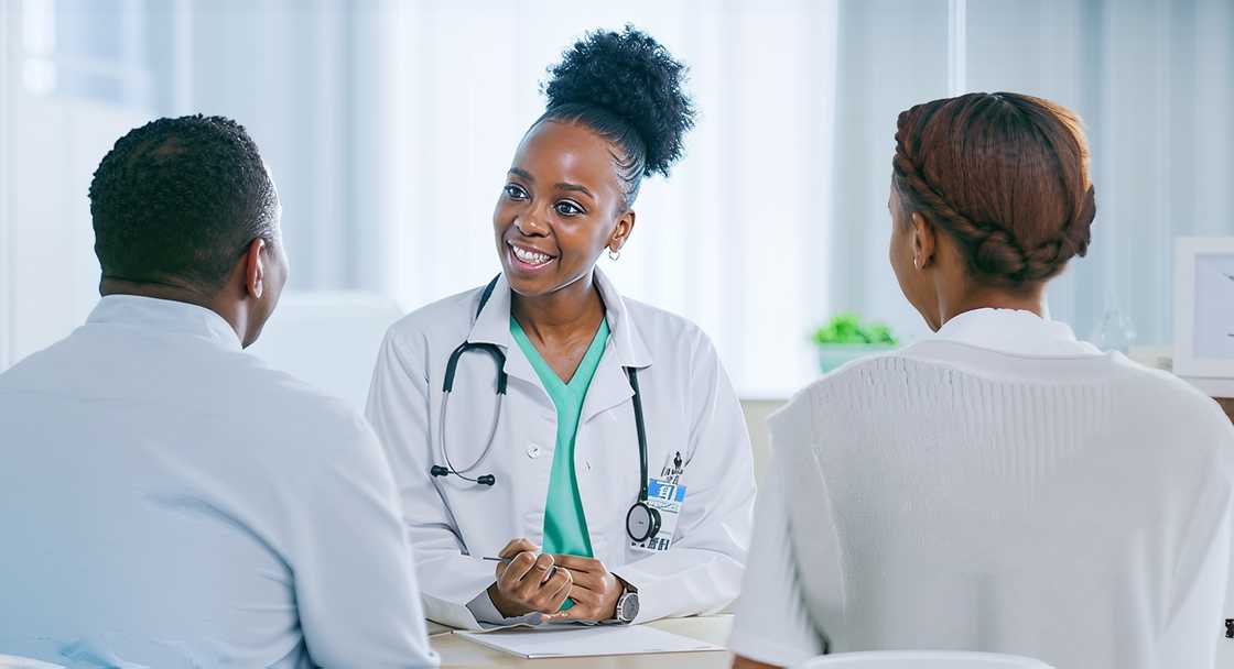 A doctor and a couple are in a hospital