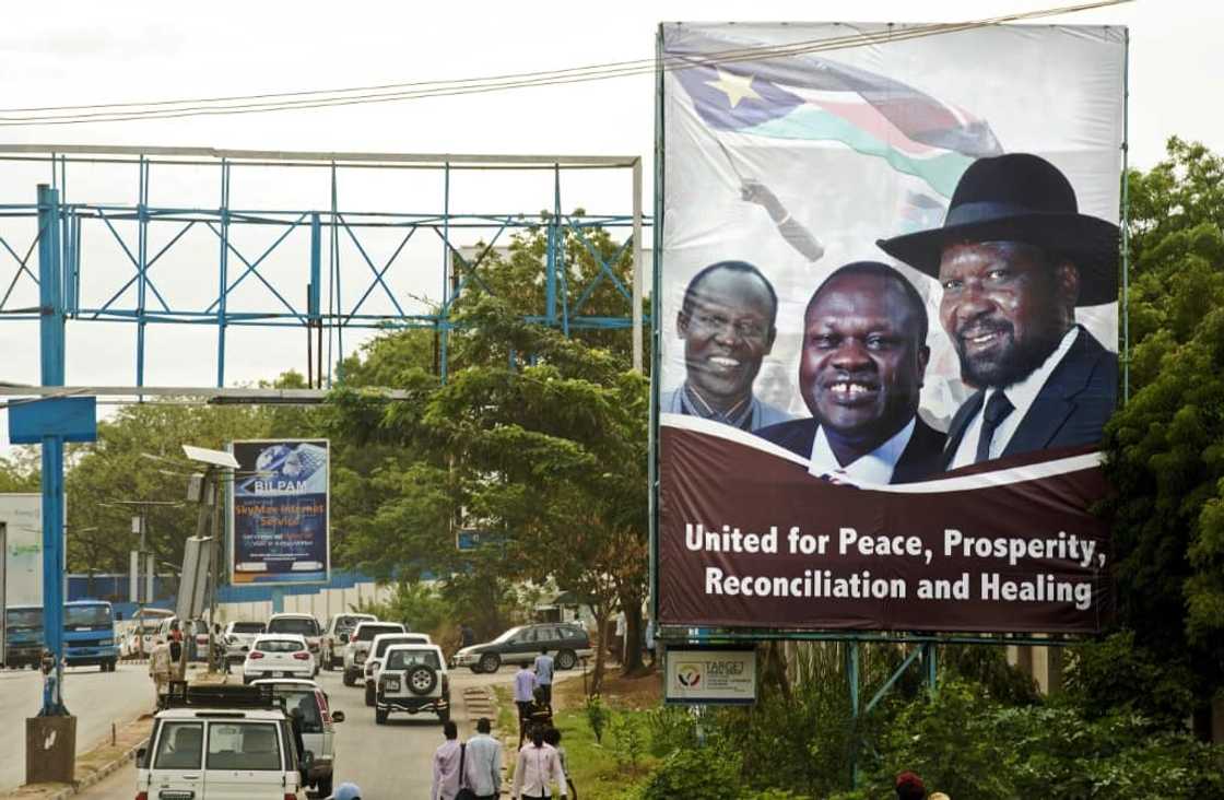 April 2016: Machar, centre, and Kiir, right, send a message of unity