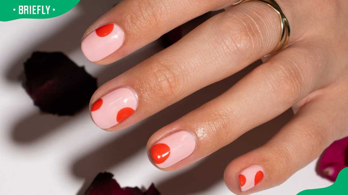 Striking red dots nail design Striking red dots nail design