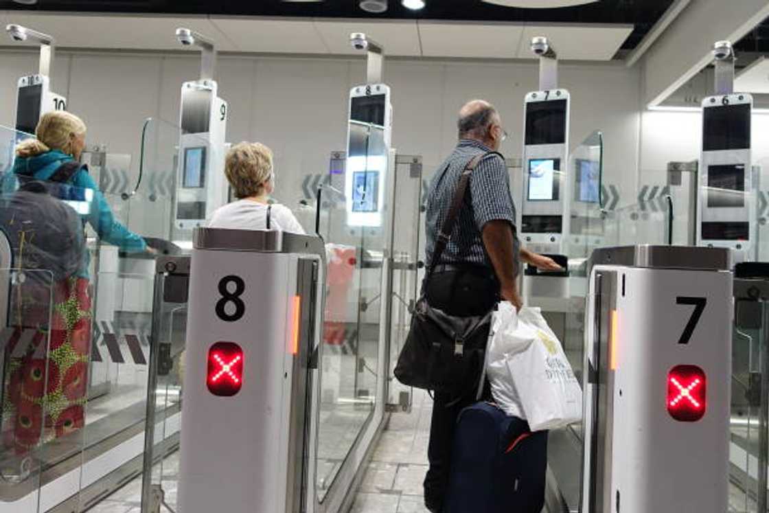 Travelers going through customs Travelers going through customs