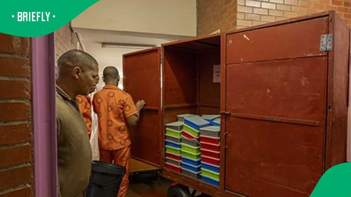 The video shows a female inmate and a male correctional officer hugging and kissing one another The video shows a female inmate and a male correctional officer hugging and kissing one another