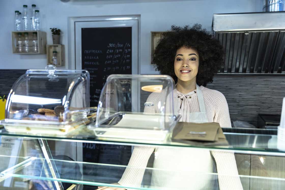 A concerned waitress talking to someone