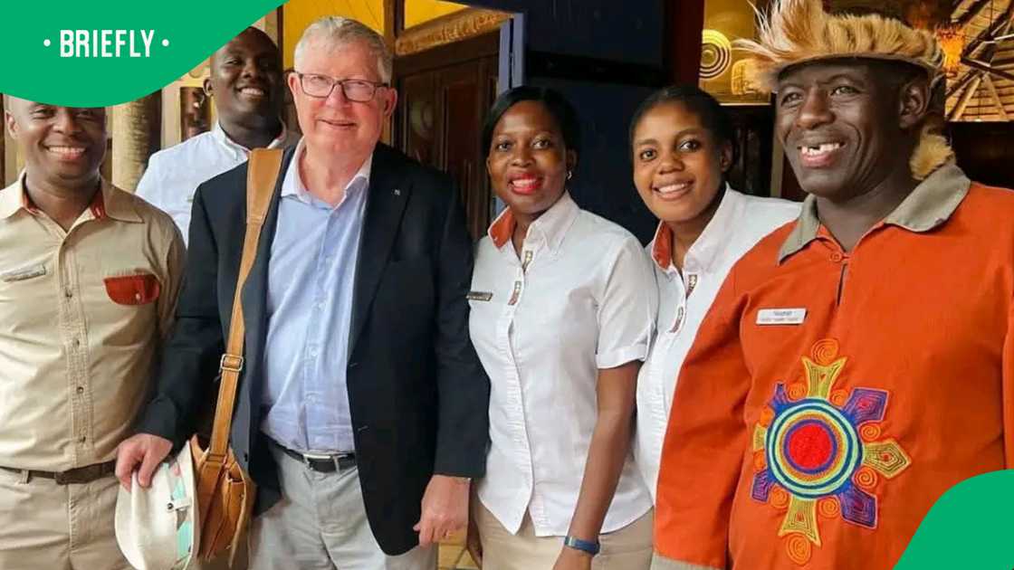 Former Manchester United manager Sir Alex Ferguson for a photo with Lodge Staff in Victoria Falls, Zimbabwe.