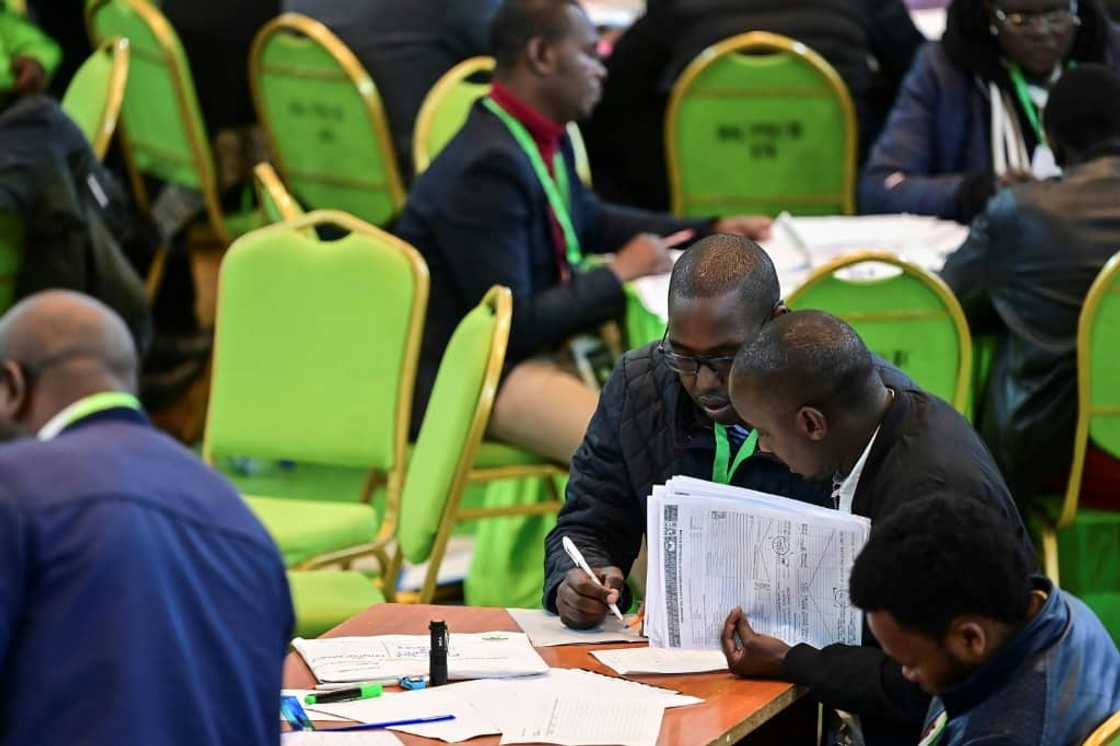 The election commission is under heavy pressure to deliver a clean poll and release results by Tuesday The election commission is under heavy pressure to deliver a clean poll and release results by Tuesday