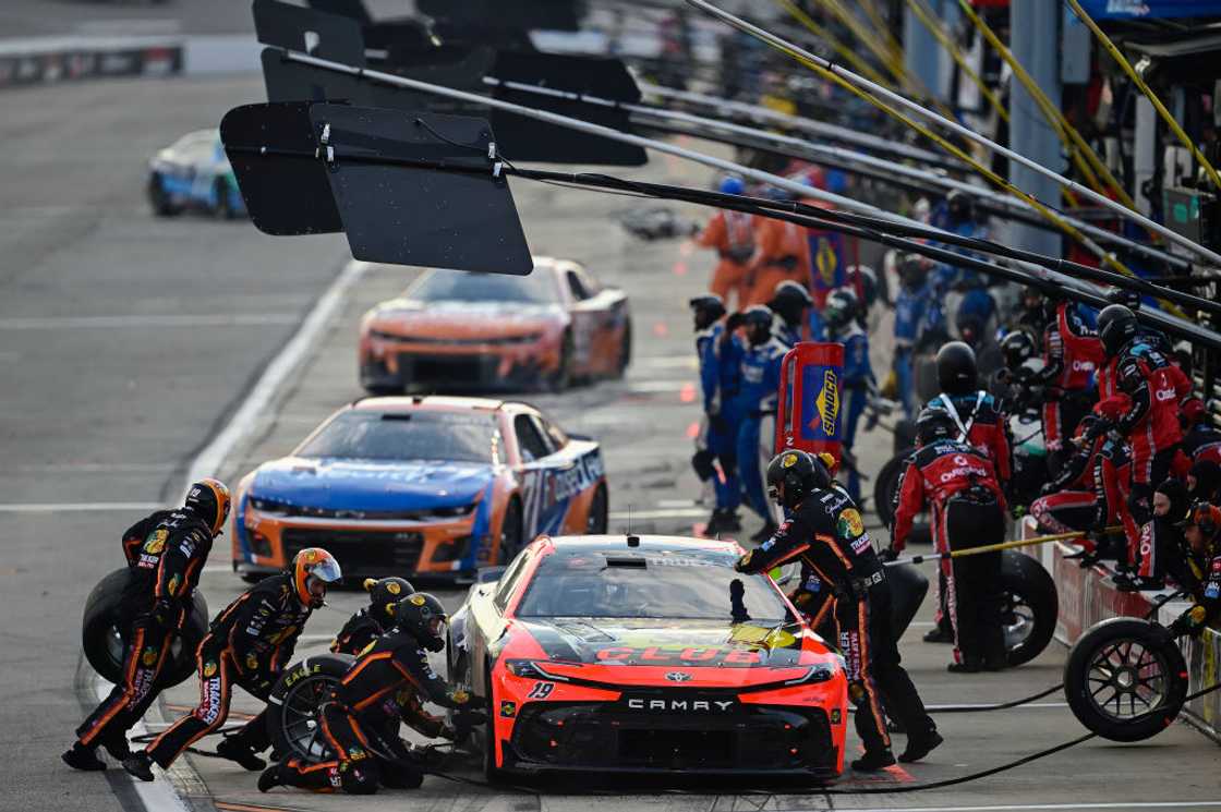 Pit crew working on Martin Truex Jr.'s race car