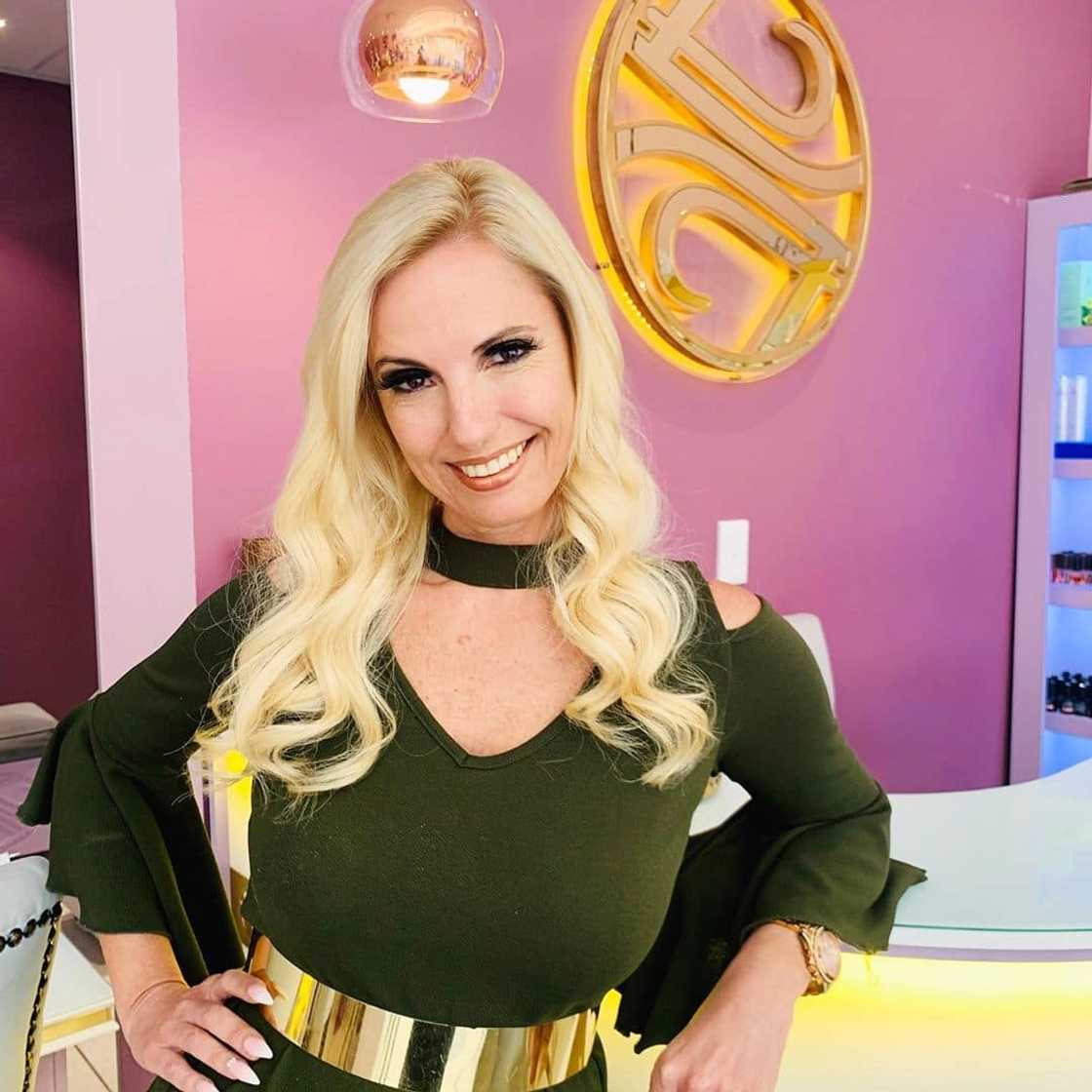 Christall Kay in a green dress and gold belt Christall Kay in a green dress and gold belt